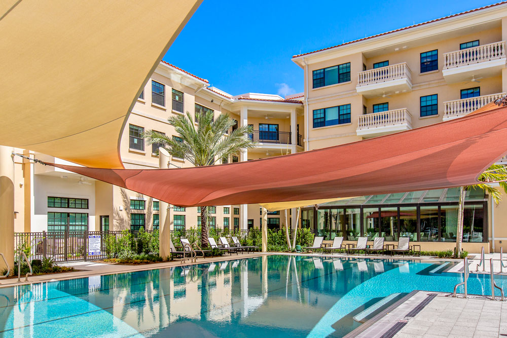 outdoor swimming pool with shade canopies